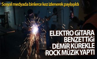 Elektro gitara benzettiği demir kürekle rock müzik yaptı